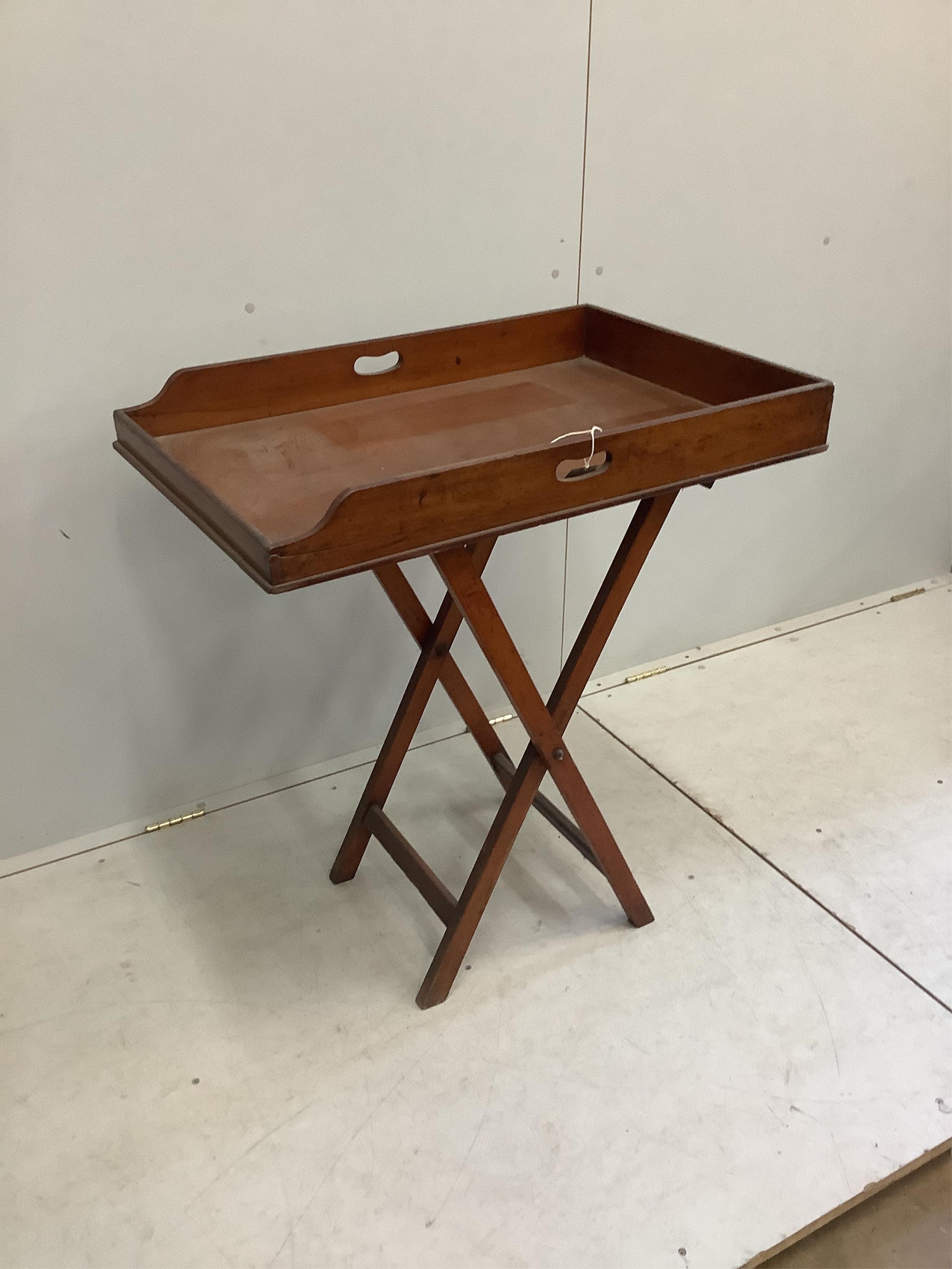 A Victorian rectangular mahogany butler's tray on folding stand, width 78cm, depth 52cm, height 90cm. Condition - fair